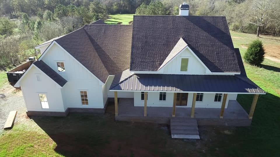 aerial view of the front of the Boone House showing roofline, front porch and entrance, garage wing and bump out