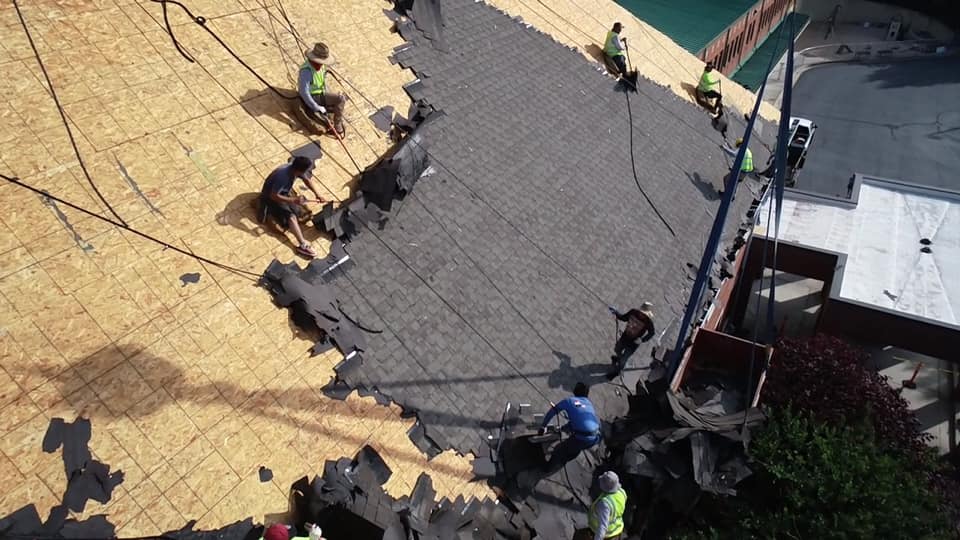 aerial of Ridgeline team removing old asphalt tiles