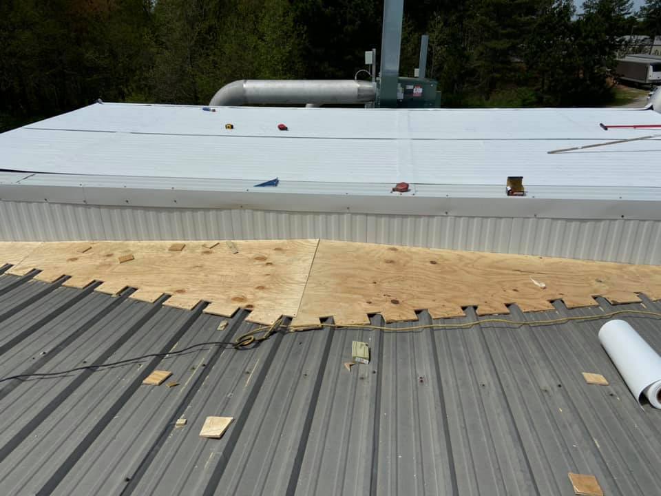 photo of new slope line being constructed for flat metal roof