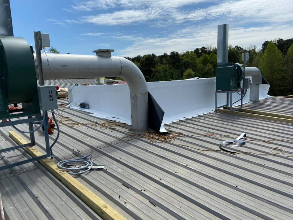 Photo of the new equipment installed on the plant's roof that left gaps in the metal roofing