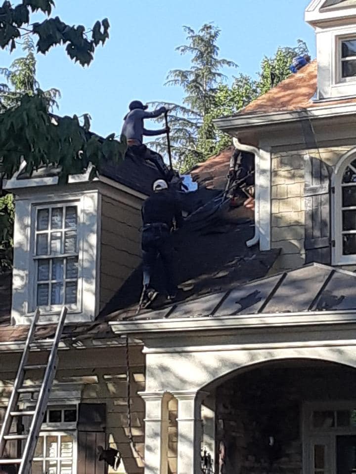 Work underway with the roof replacement on the front side of the house