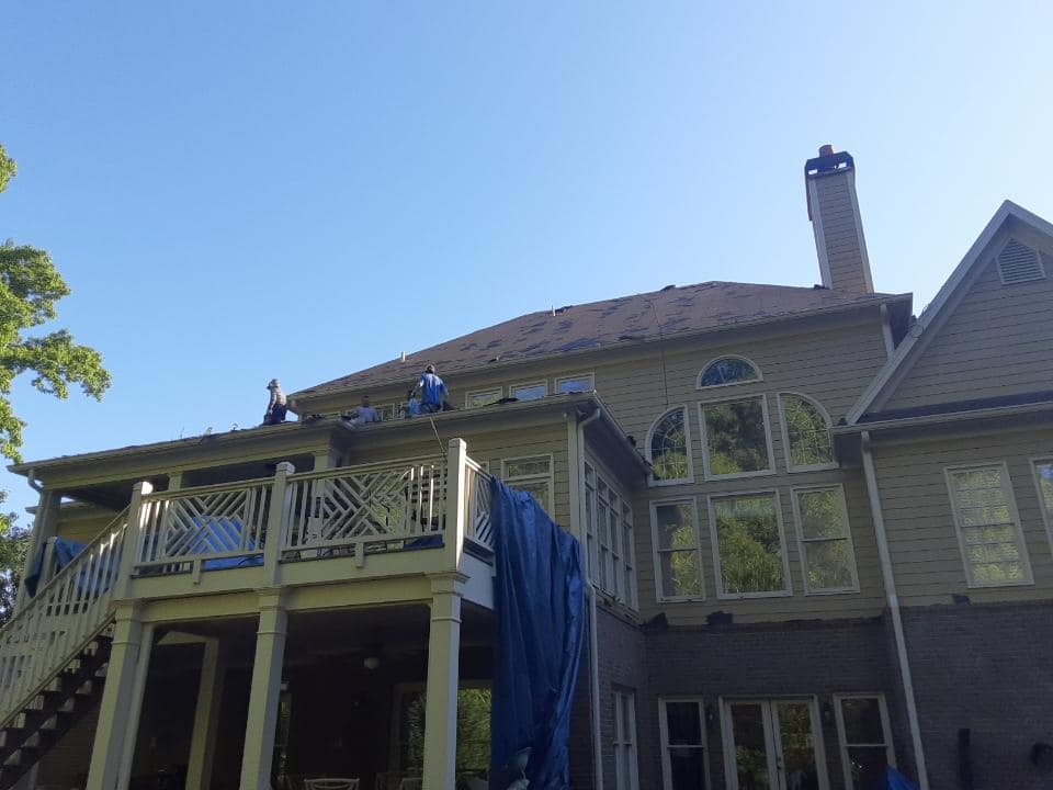 photo of rear of Cumming home while undergoing roof replacement