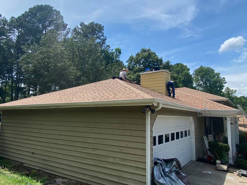 new roof down over the garage section of the home