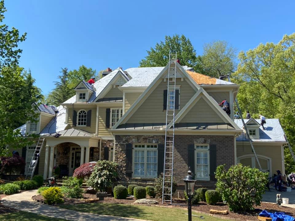 Front view of Cumming home undergoing roof replacement