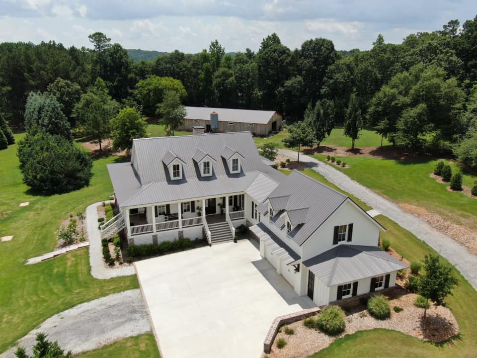 aerial photo of roof view from the entrance drive area to the home