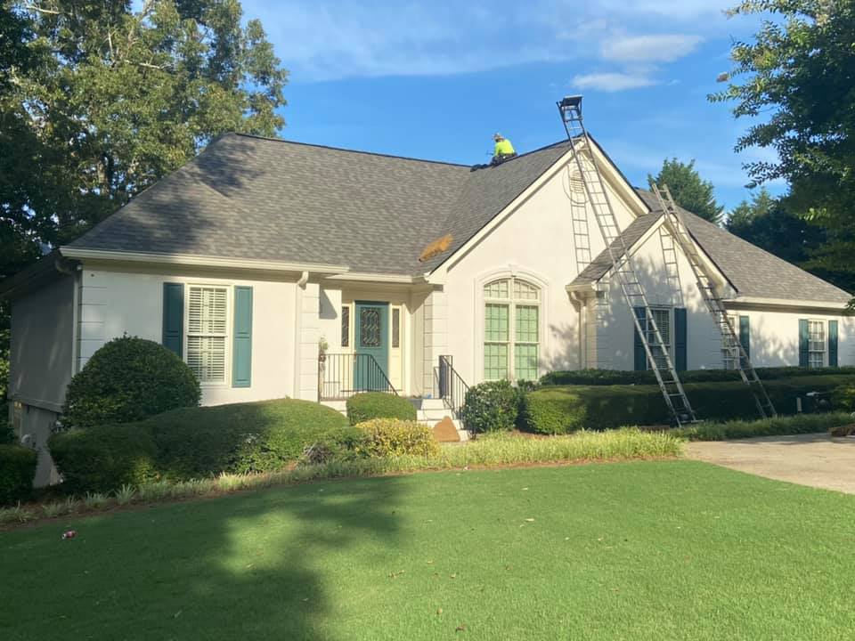 final touches on the new roof at the Watkinsville home